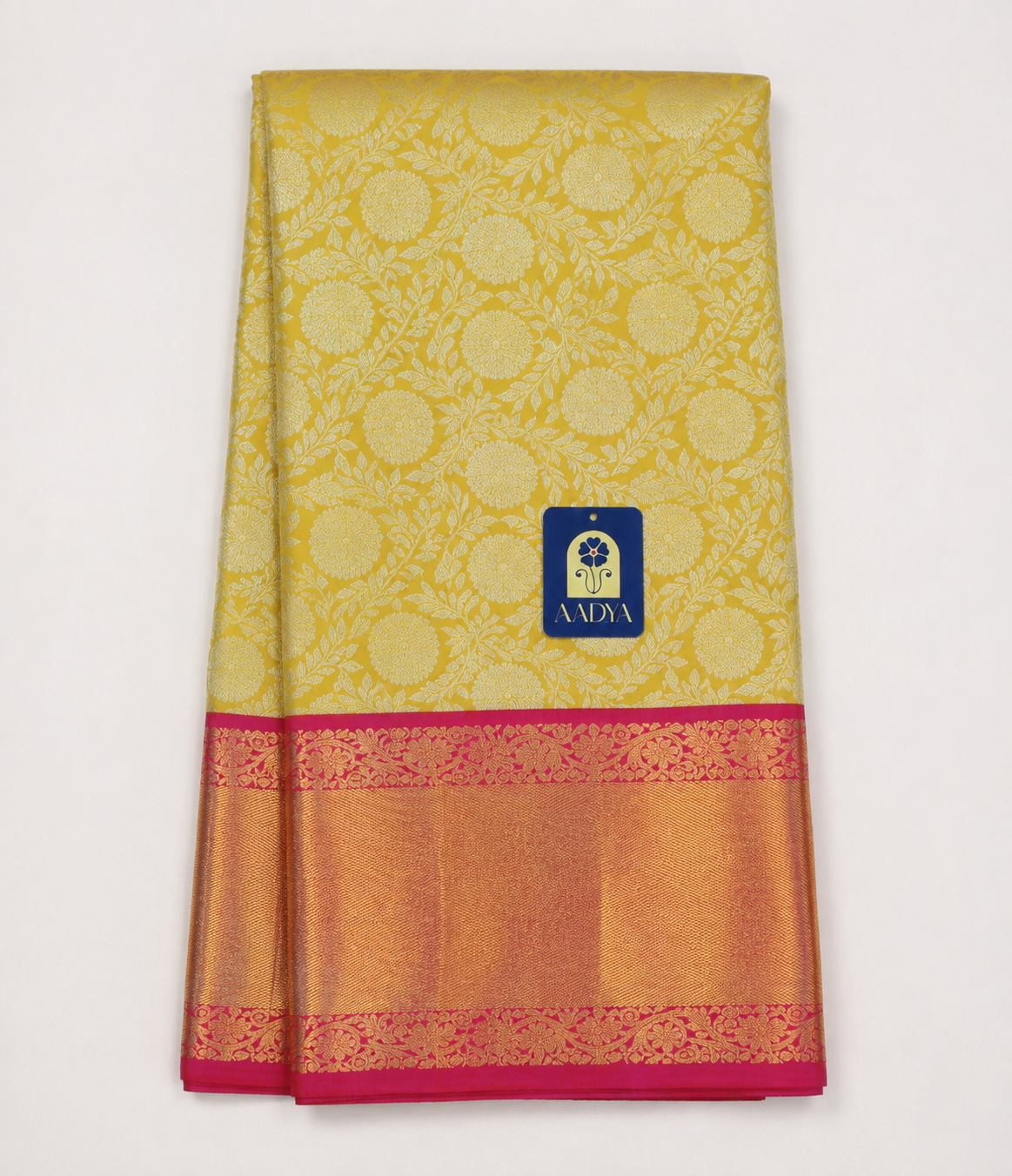 Yellow Kanchivaram Silk Saree with Silver Zari Flower Buttis & Pink Border
