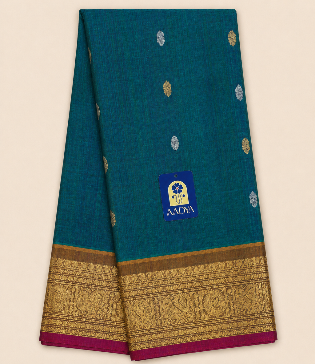 Green Gadwal Silk Saree with Silver & Gold Peacock Round Buttis and Mustard Yellow Zari Border