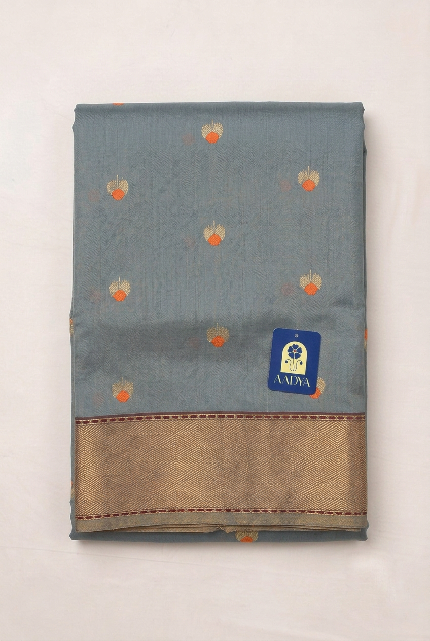 Grey Chanderi Silk Saree with Floral Meenakari Silver Buttis & Orange Cut Line Border