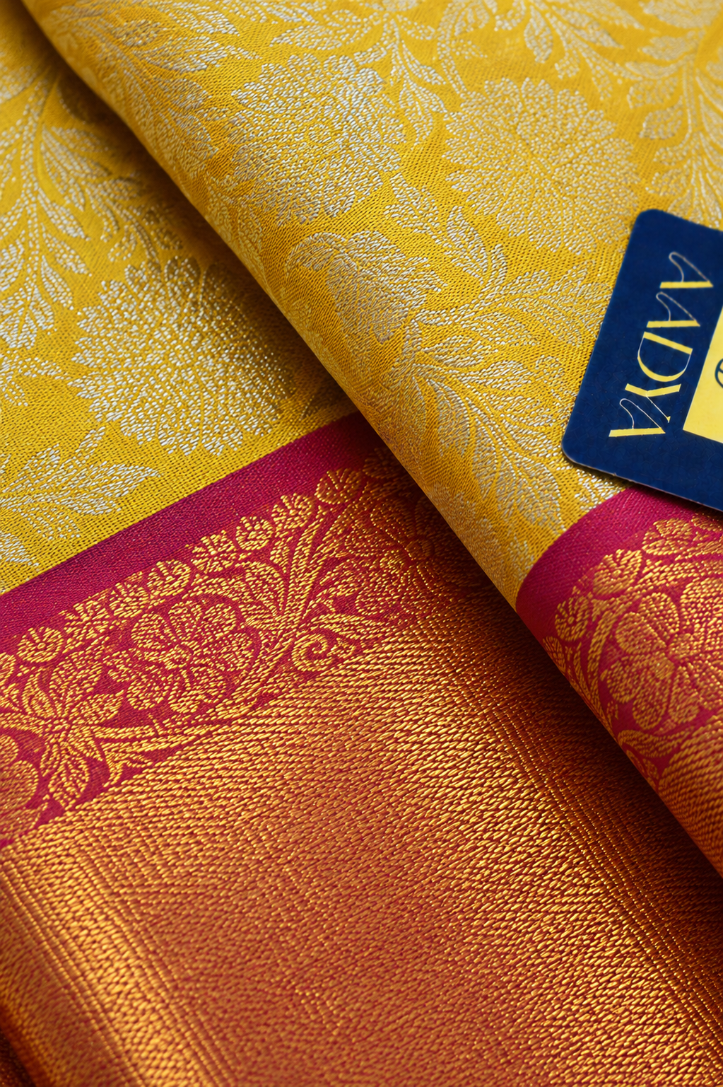 Yellow Kanchivaram Silk Saree with Silver Zari Flower Buttis & Pink Border