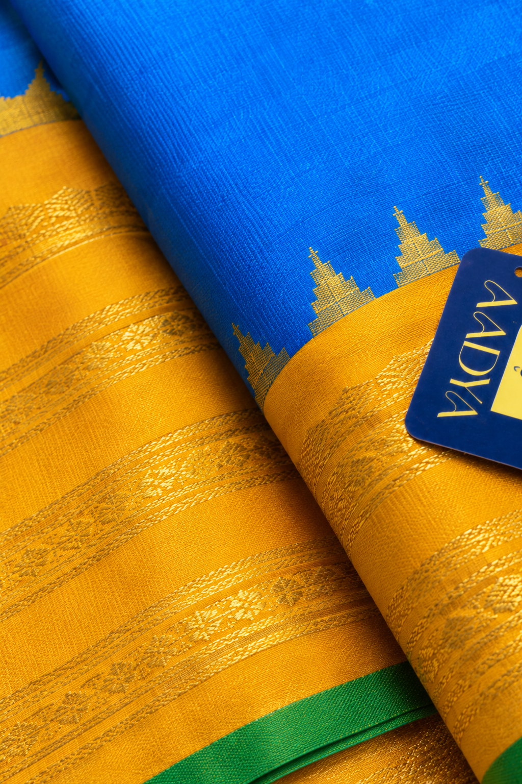 Gadwal Silk Saree in Peacock Blue with Yellow Geometric Zari Border