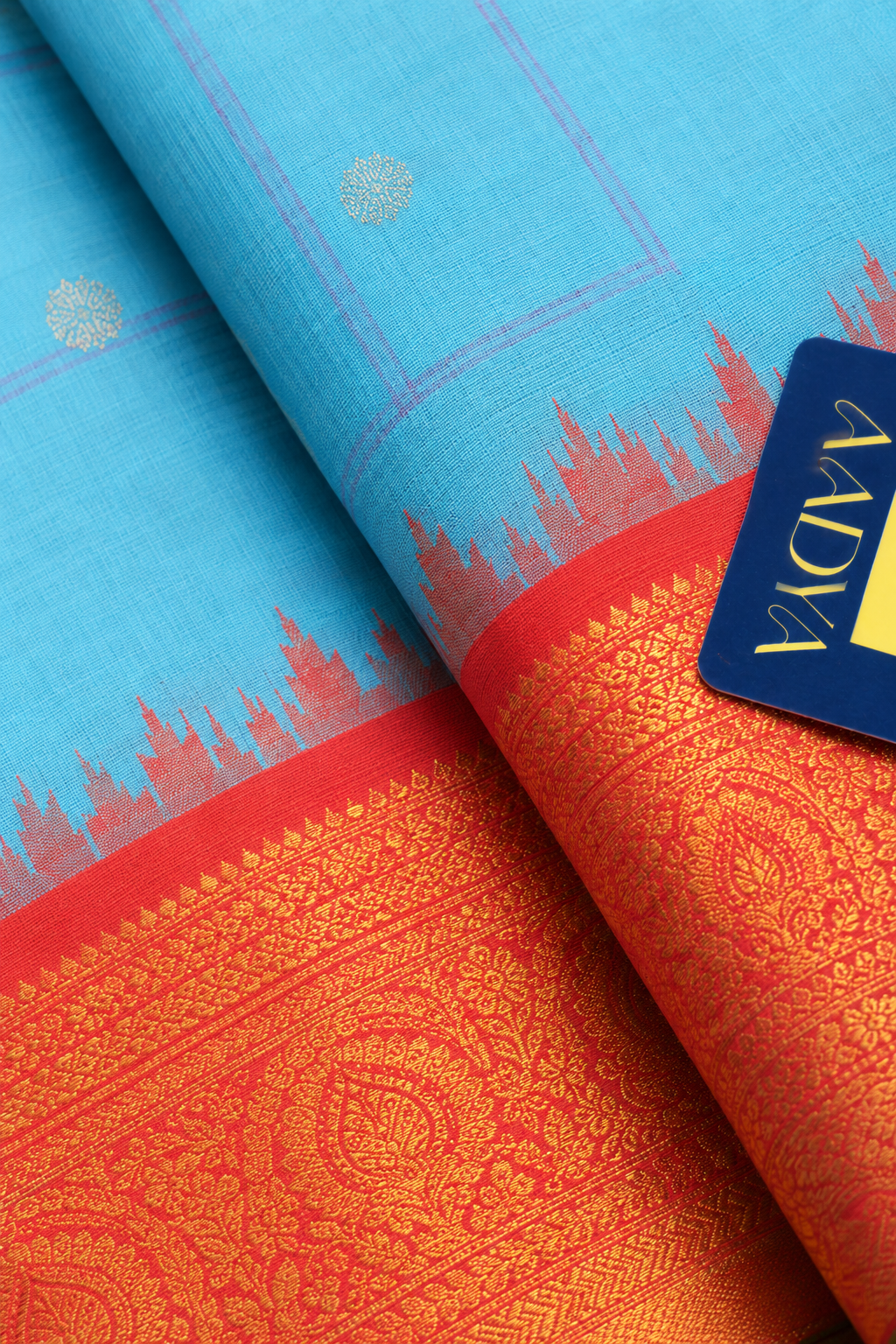 Gadwal Silk Saree in Powder Blue with Silver Peacock Buttis & Rani Pink Temple Border