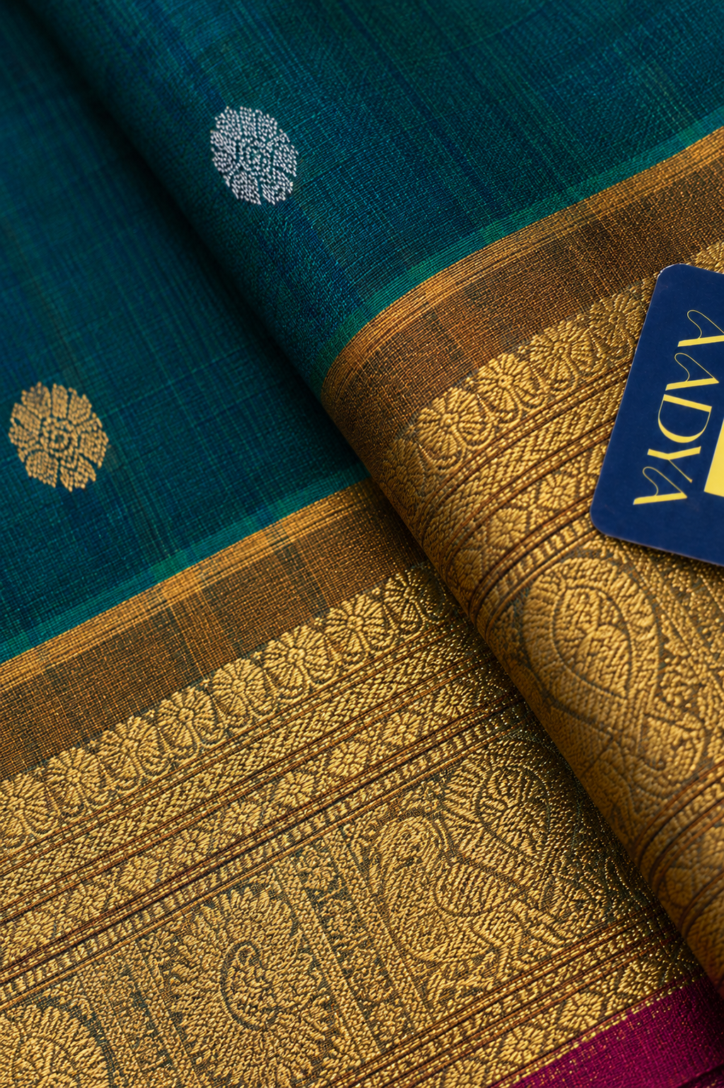 Green Gadwal Silk Saree with Silver & Gold Peacock Round Buttis and Mustard Yellow Zari Border