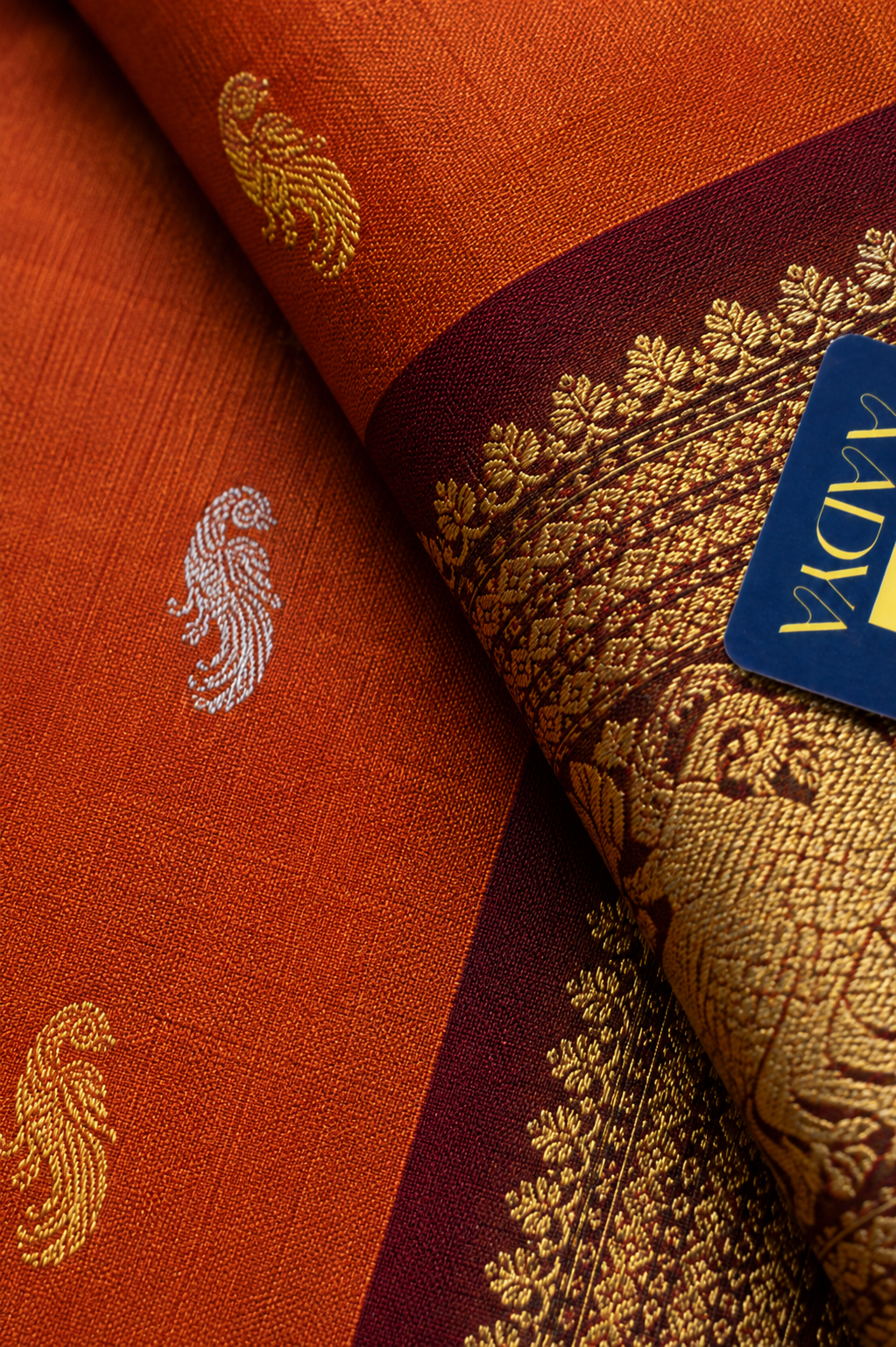 Orange Gadwal Silk Saree with Silver & Gold Deer and Parrot Buttis