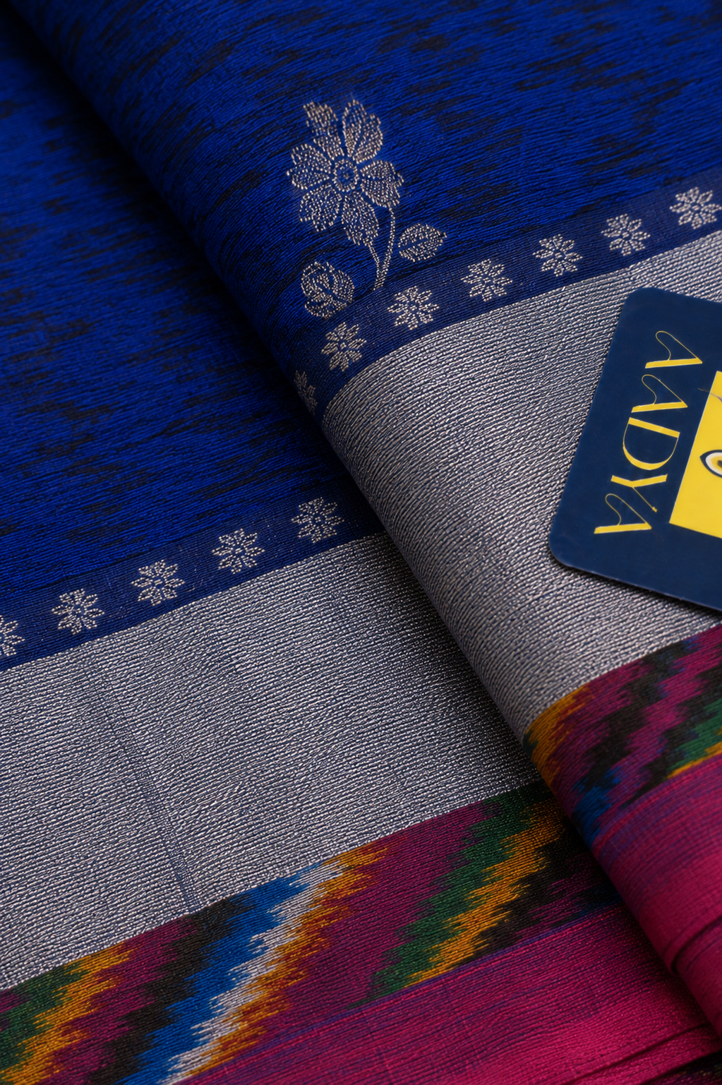 Navy Blue Puttapaka Ikkat Eri Silk Saree with Flower Buttis & Silver Zari Border
