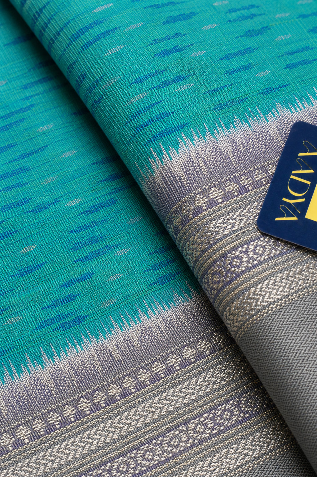 Green Puttapaka Ikkat Eri Silk Saree with Silver Butti Border & Grey Pallu