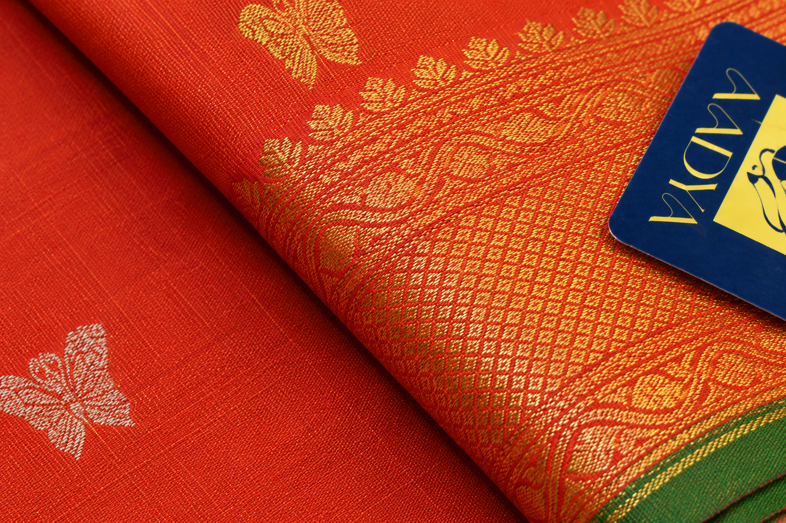 Mustard Orange Gadwal Twill Silk Saree with Gold & Silver Floral Buttis