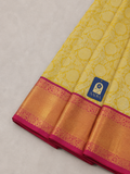 Yellow Kanchivaram Silk Saree with Silver Zari Flower Buttis & Pink Border