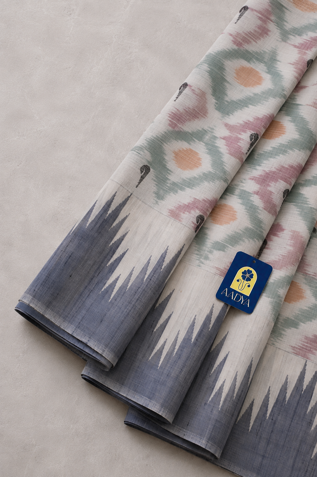 Off White Ikkat Gadwal Silk Saree with Diamond-Eye Geometric Motifs & Muniya Butti Pallu