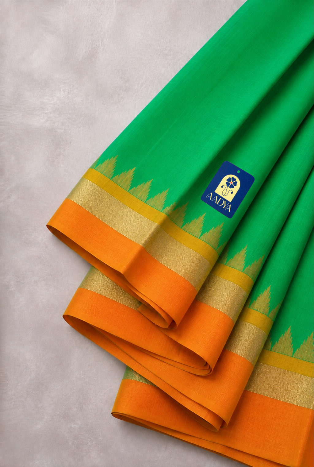 Green Puttapaka Ikkat Silk Saree with Orange & Yellow Ganga Jamuna Border