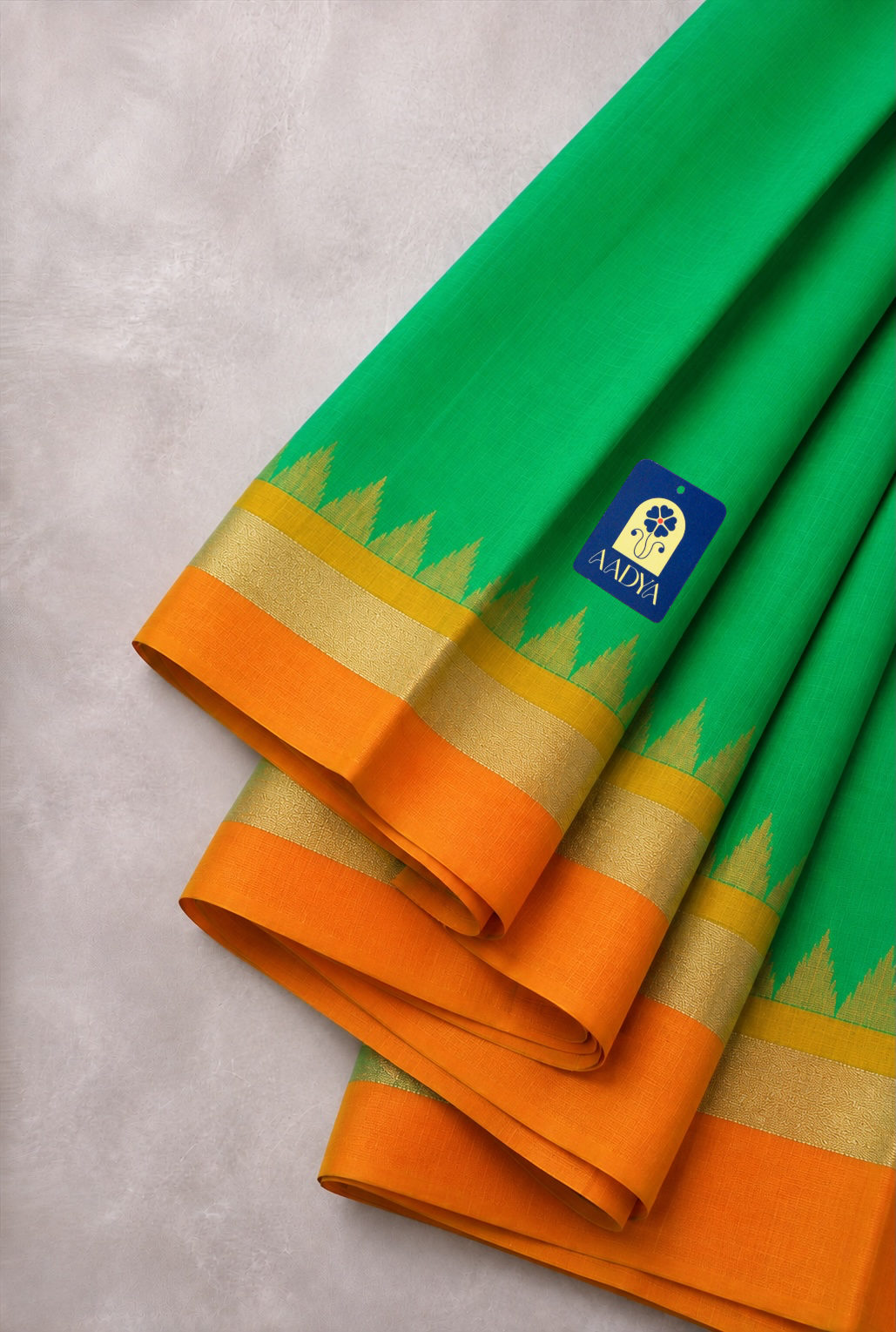 Green Puttapaka Ikkat Silk Saree with Orange & Yellow Ganga Jamuna Border