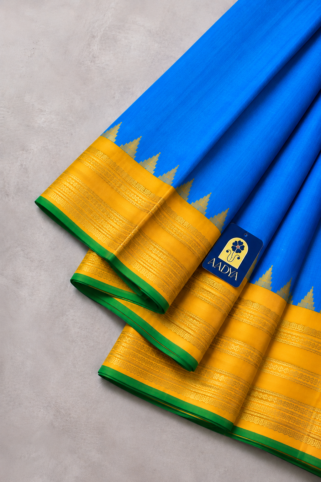 Gadwal Silk Saree in Peacock Blue with Yellow Geometric Zari Border