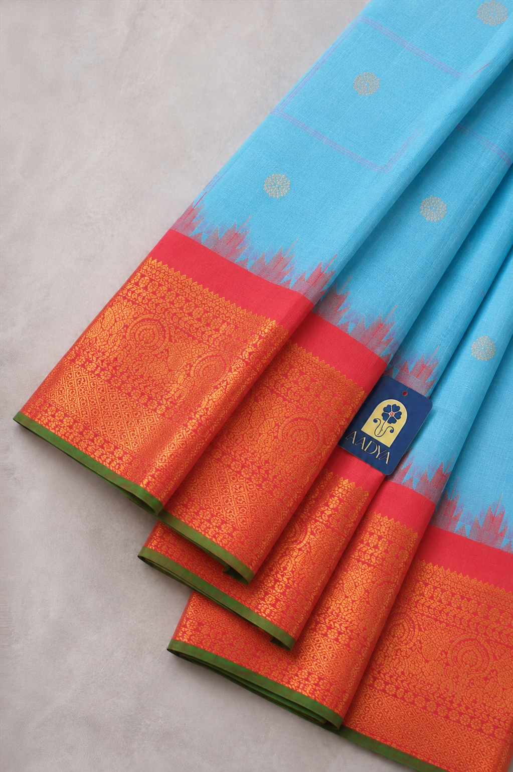 Gadwal Silk Saree in Powder Blue with Silver Peacock Buttis & Rani Pink Temple Border