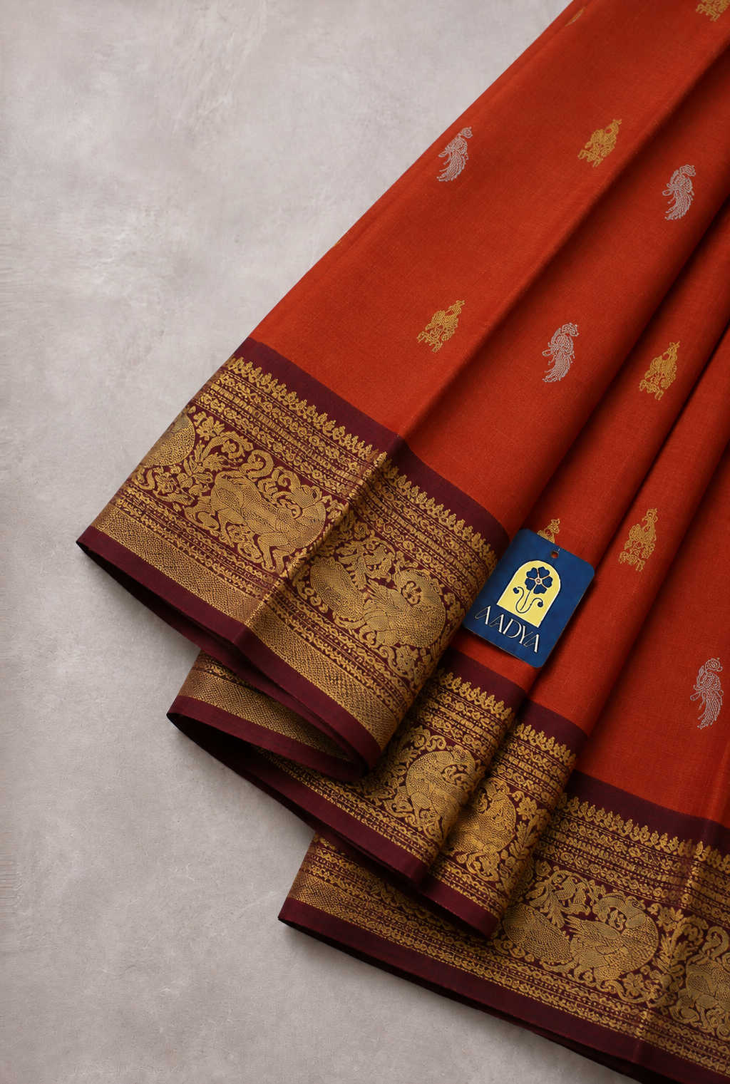 Orange Gadwal Silk Saree with Silver & Gold Deer and Parrot Buttis