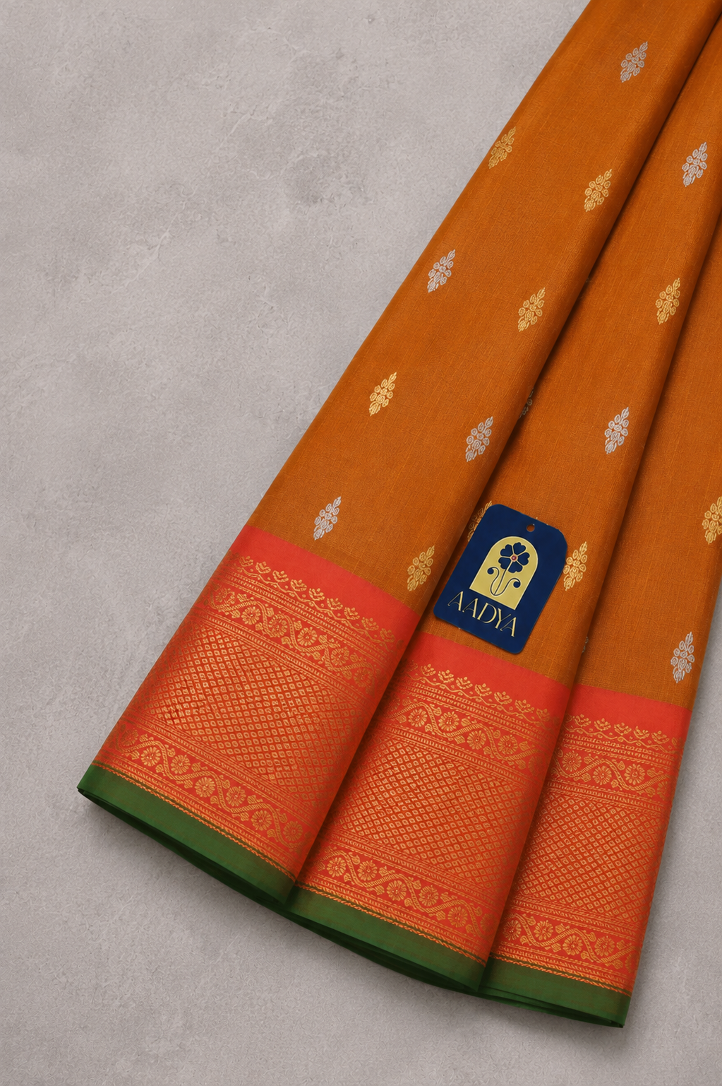 Mustard Orange Gadwal Twill Silk Saree with Gold & Silver Floral Buttis