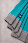 Green Puttapaka Ikkat Eri Silk Saree with Silver Butti Border & Grey Pallu