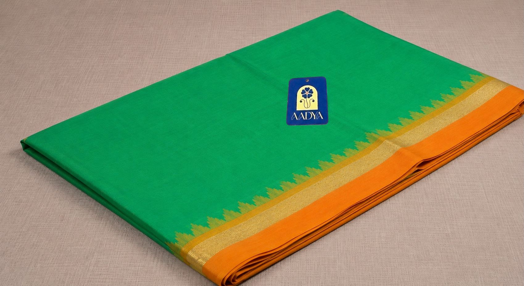 Green Puttapaka Ikkat Silk Saree with Orange & Yellow Ganga Jamuna Border