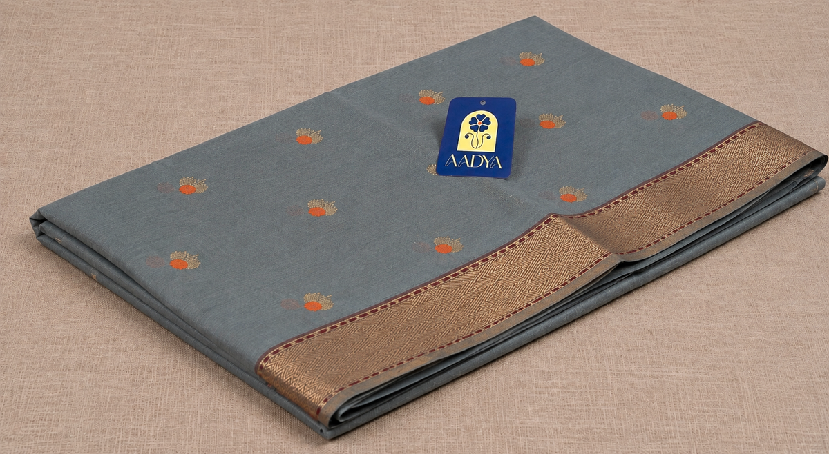 Grey Chanderi Silk Saree with Floral Meenakari Silver Buttis & Orange Cut Line Border