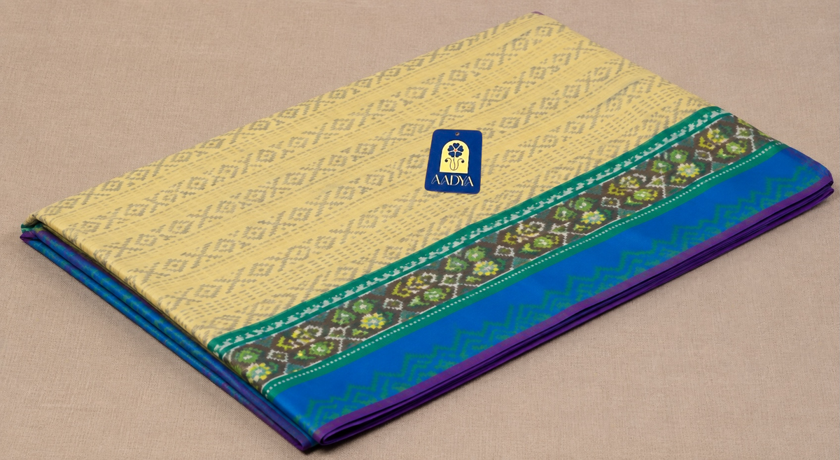 Cream Patola Eri Silk Saree with Peacock Blue Wave Border & Blue-Green Patola Pallu
