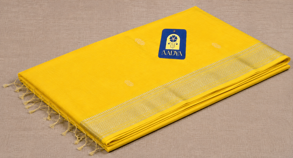 Yellow Maheshwari Silk Saree with White Thread Flower Buttis & Silver Zari Border