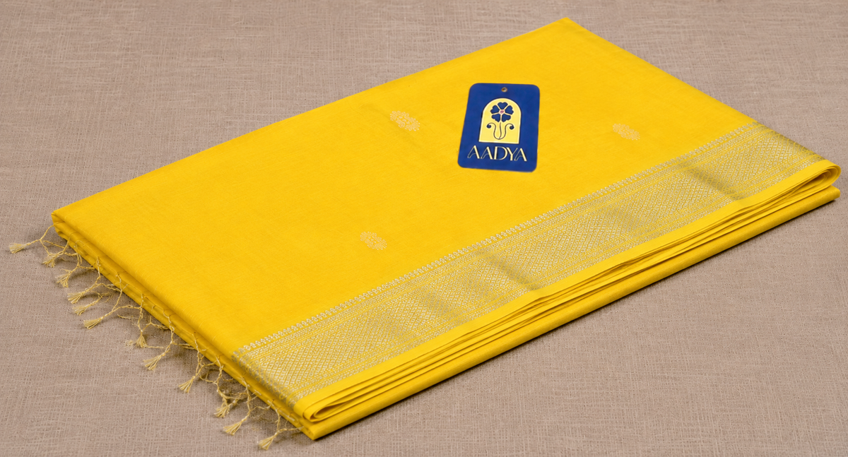 Yellow Maheshwari Silk Saree with White Thread Flower Buttis & Silver Zari Border