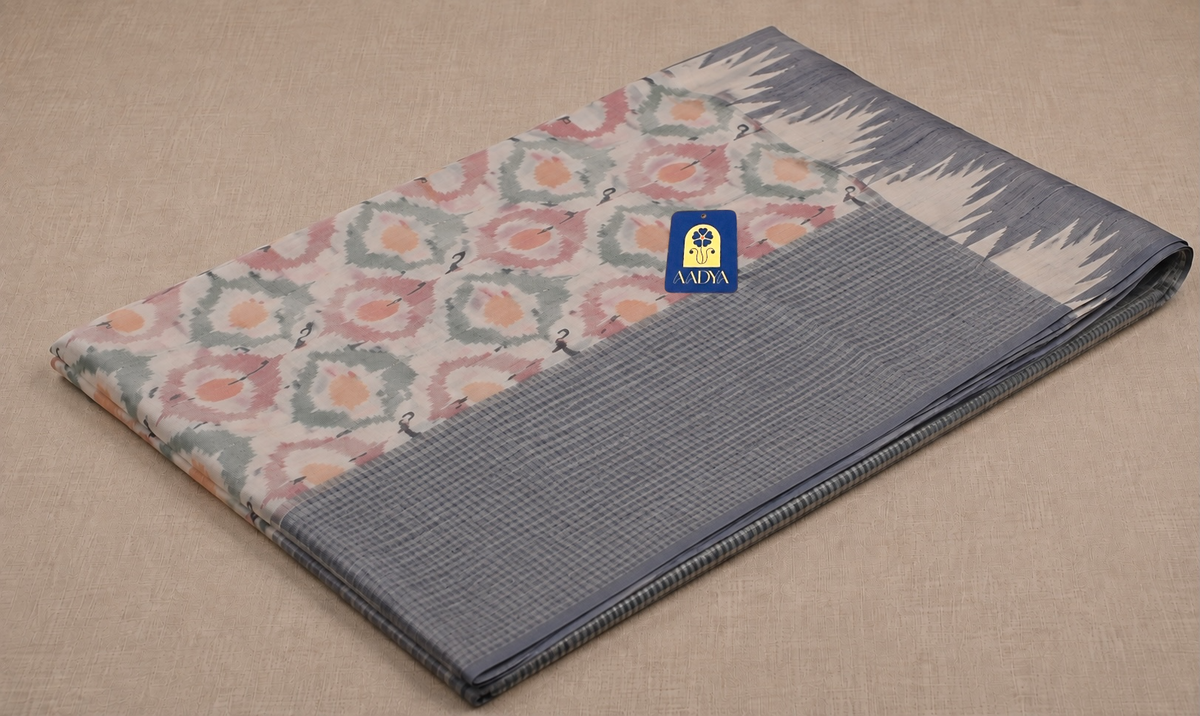 Off White Ikkat Gadwal Silk Saree with Diamond-Eye Geometric Motifs & Muniya Butti Pallu