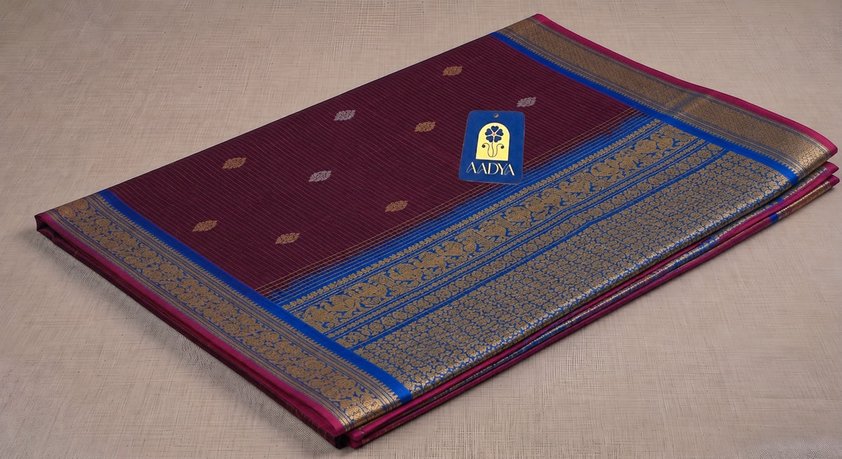 Magenta Gadwal Sico Saree with Gold & Silver Thread Flower Buttis and Peacock Blue Zari Border
