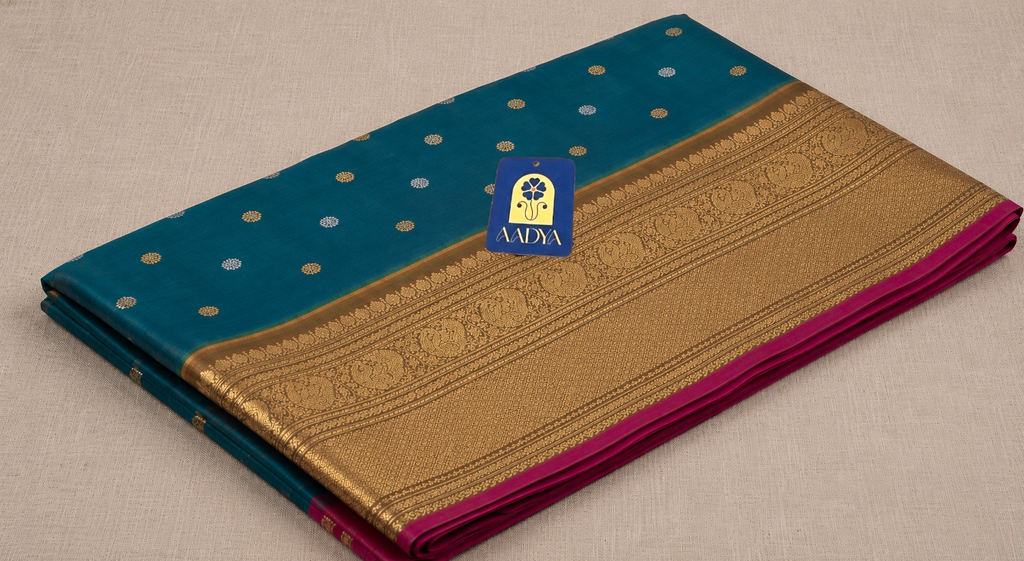 Green Gadwal Silk Saree with Silver & Gold Peacock Round Buttis and Mustard Yellow Zari Border