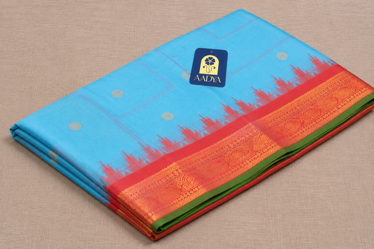 Gadwal Silk Saree in Powder Blue with Silver Peacock Buttis & Rani Pink Temple Border