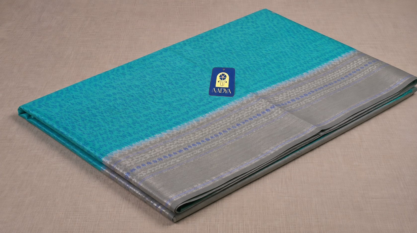 Green Puttapaka Ikkat Eri Silk Saree with Silver Butti Border & Grey Pallu