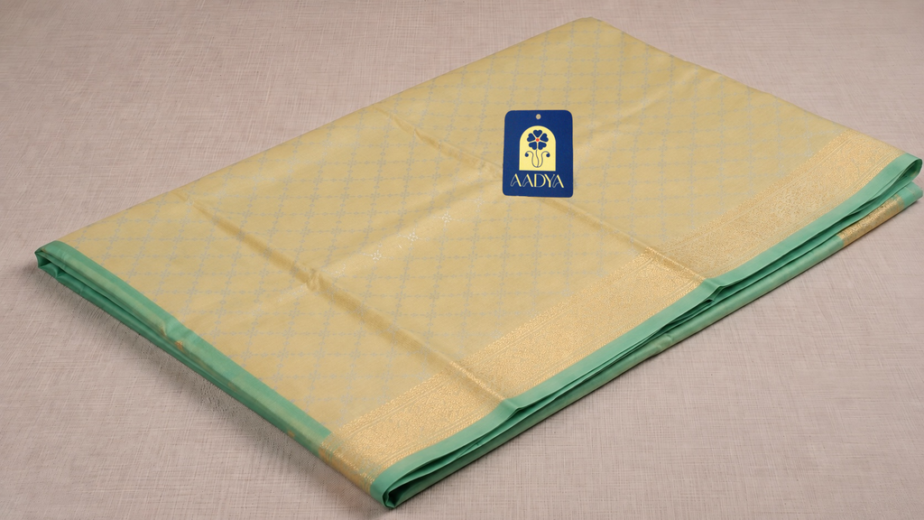 Light Yellow Banaras Silk Saree with Silver & Gold Zari Border and Green Selvage
