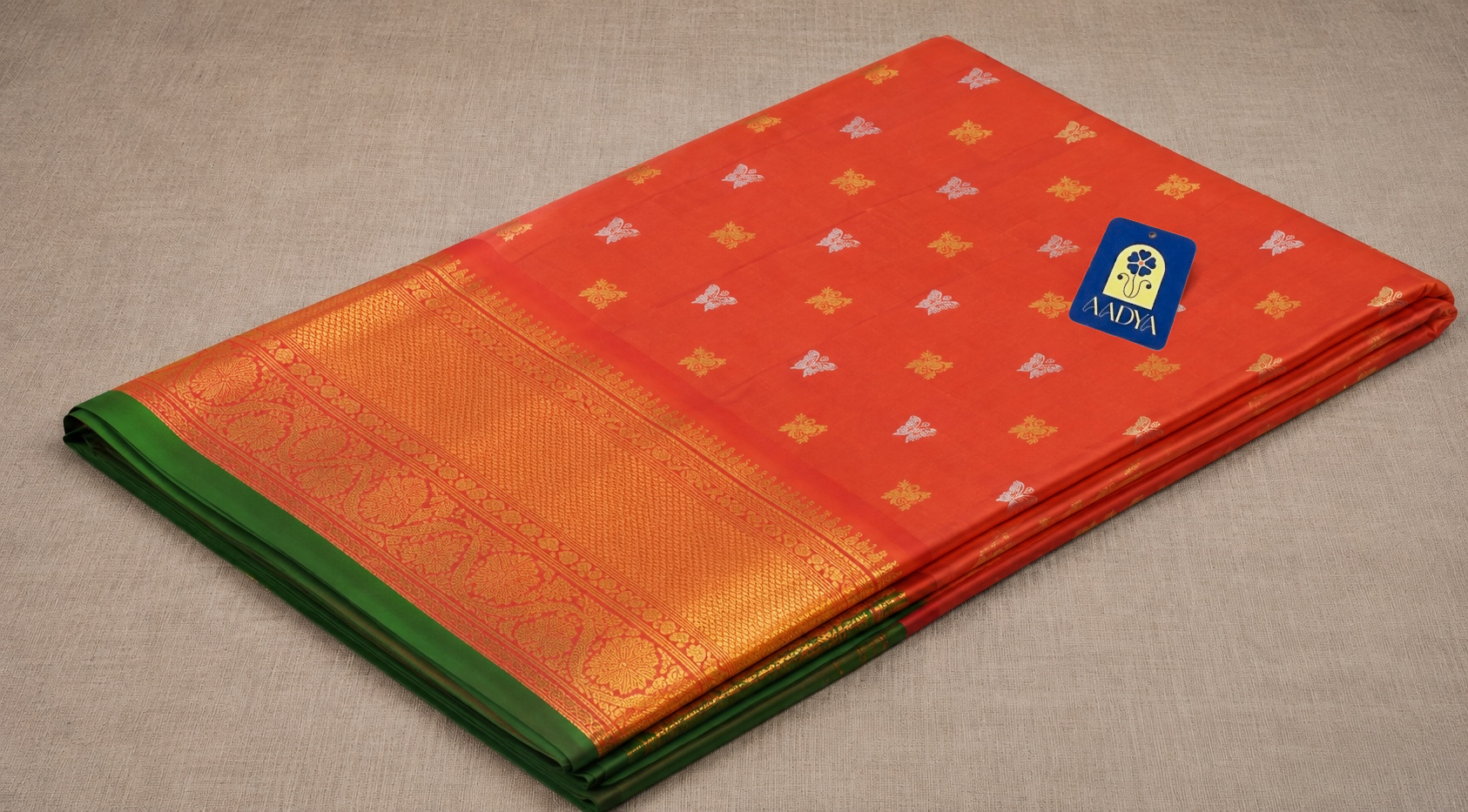 Mustard Orange Gadwal Twill Silk Saree with Gold & Silver Floral Buttis