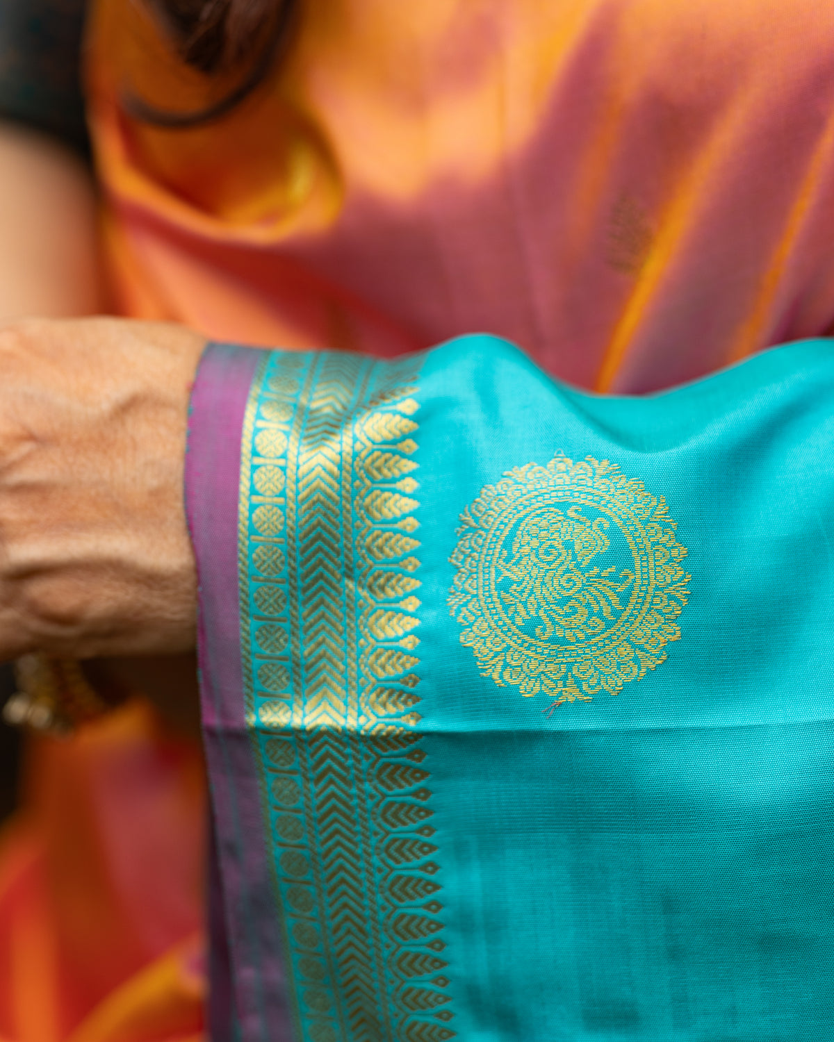 Peach Pink and Turquoise Blue Silk Saree with Gold Butta Motifs and Contrast Border