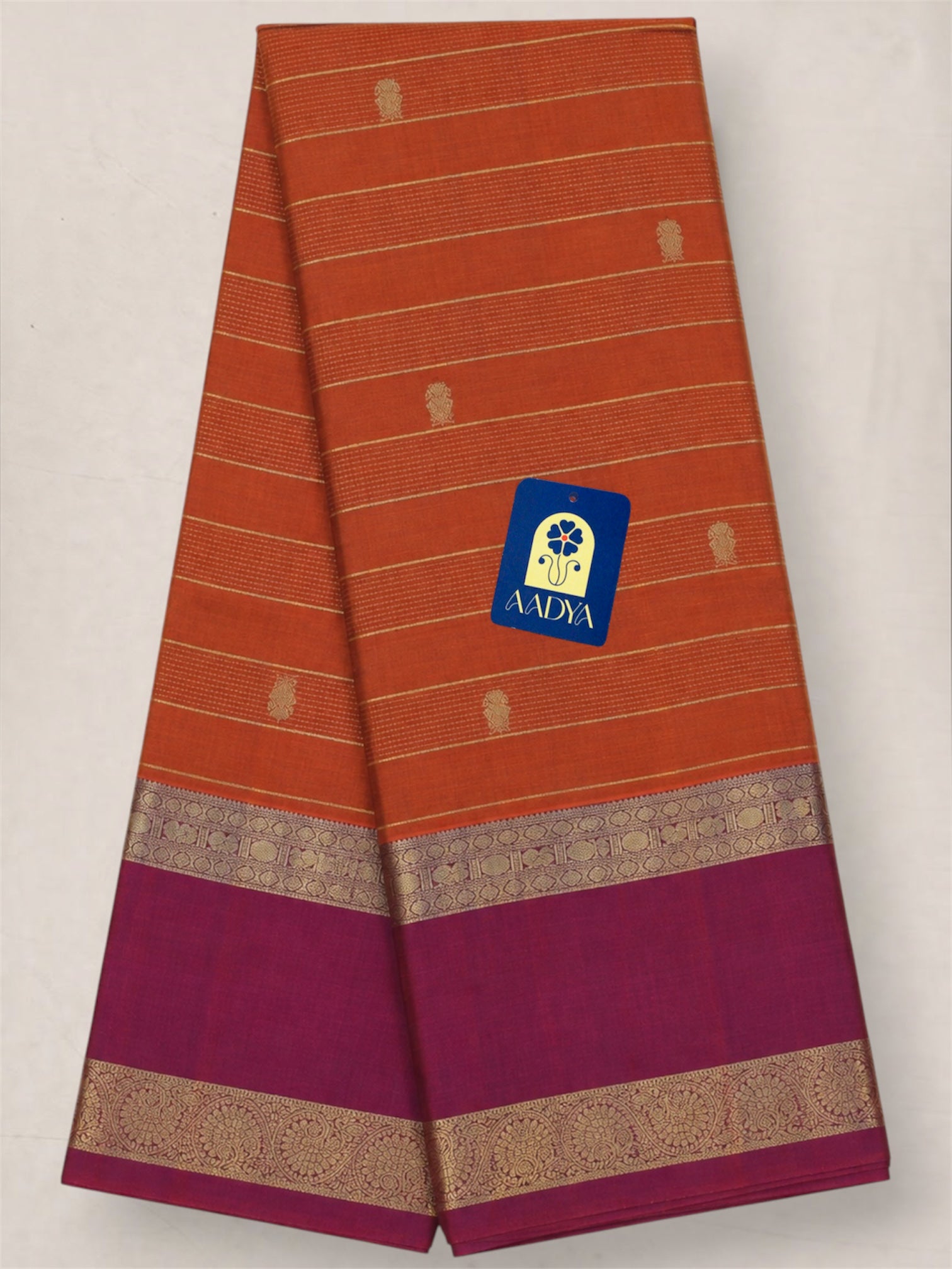 Mustard Orange Kanchivaram Silk Saree with Zari Buttis & Rani Pink Border