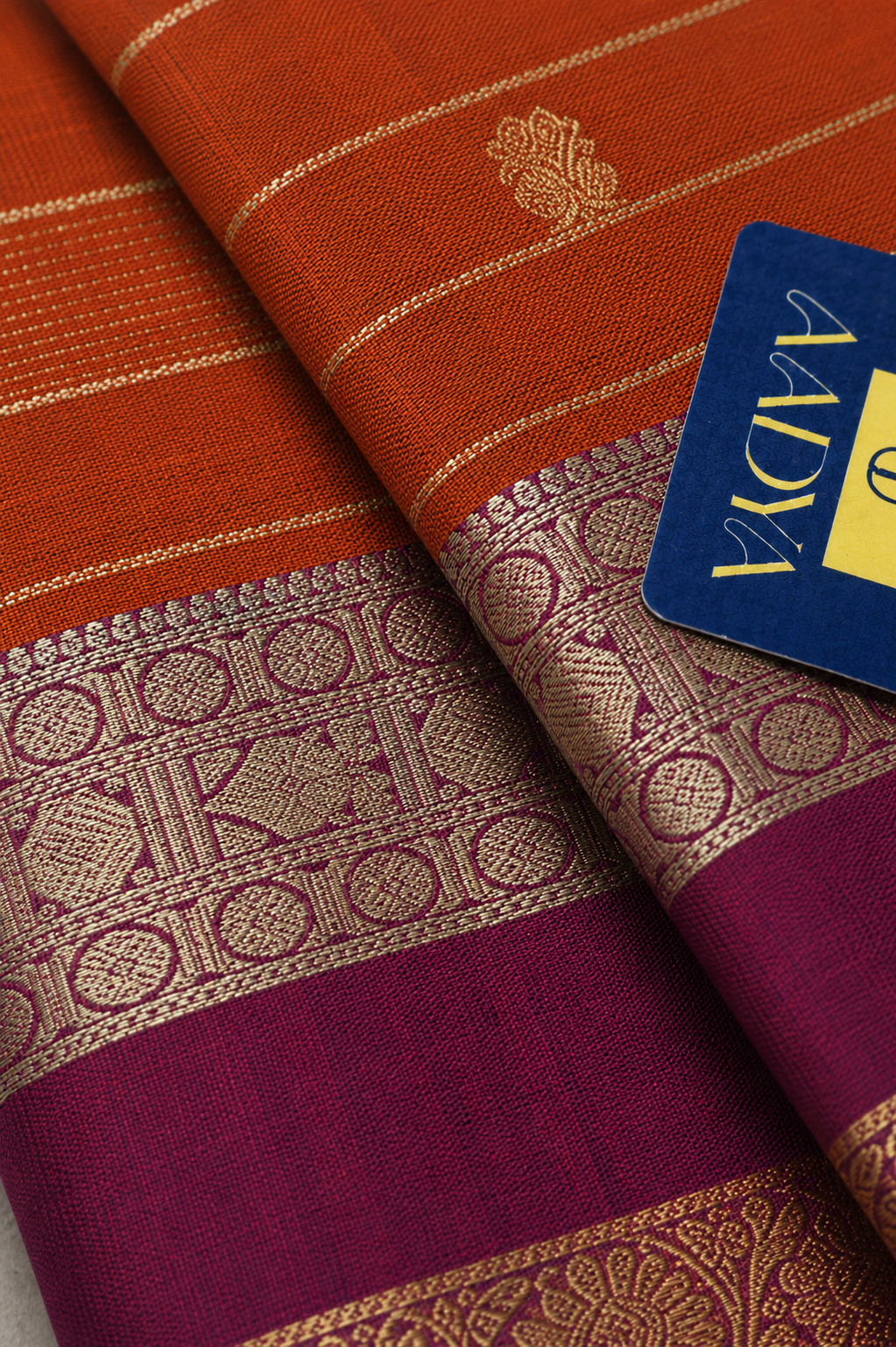 Mustard Orange Kanchivaram Silk Saree with Zari Buttis & Rani Pink Border