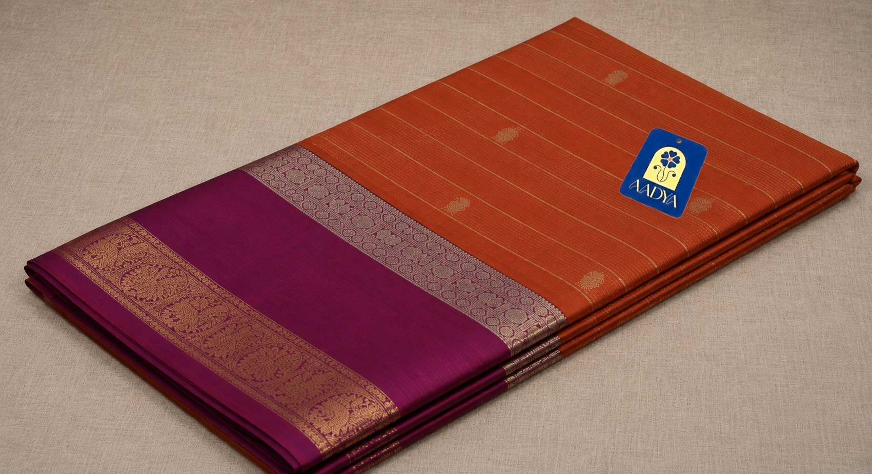 Mustard Orange Kanchivaram Silk Saree with Zari Buttis & Rani Pink Border